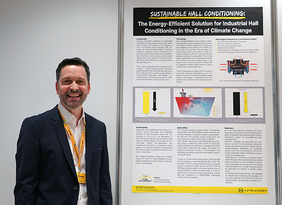 Mann neben Infranorm Poster bei der Poster Präsentation auf den World Sustainable Energy Days 2025